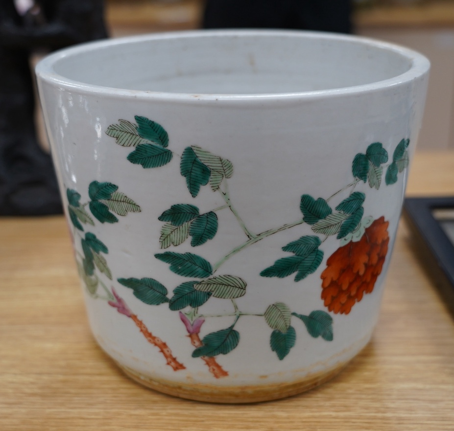 A 19th century Chinese famille rose flower pot, 19.5cm high. Condition - hole drilled to base.